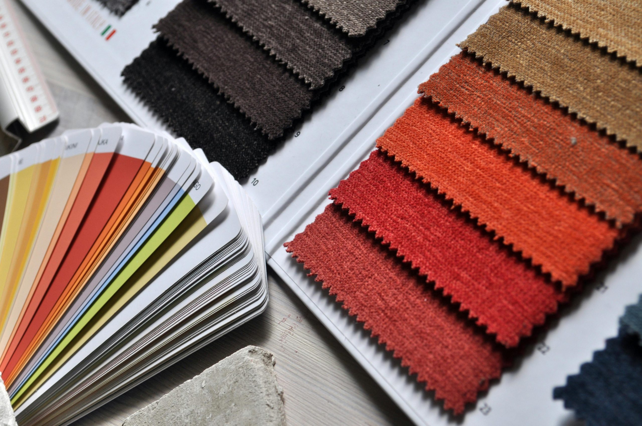 Sourcing Materials for Clothing Samples Small rolls of fabric and various trims for sampling