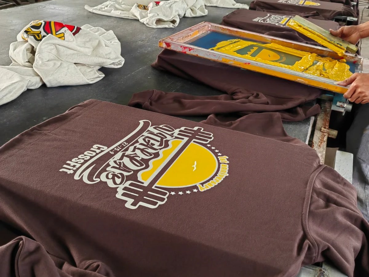 Screen printing process for custom T-shirt graphic production