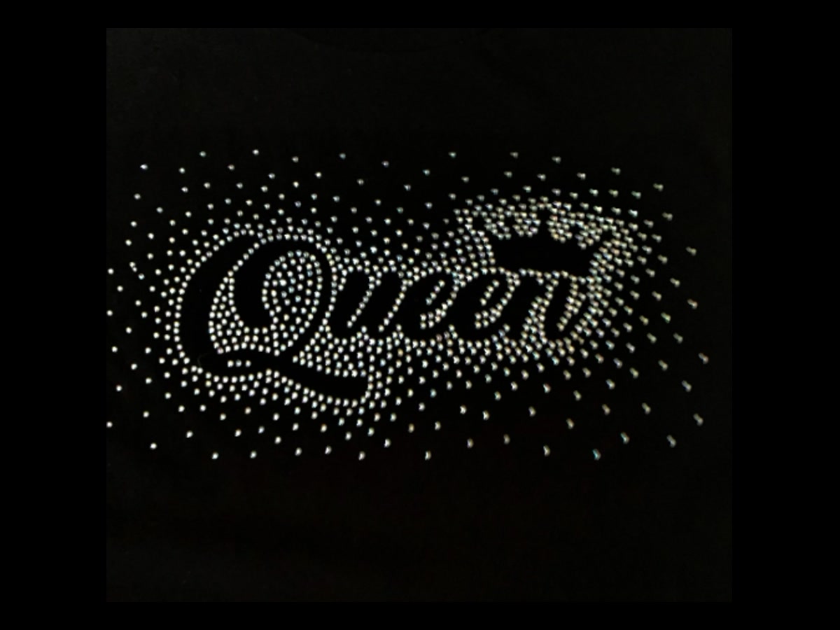 Rhinestone decoration detail on black T-shirt fabric for custom apparel embellishment