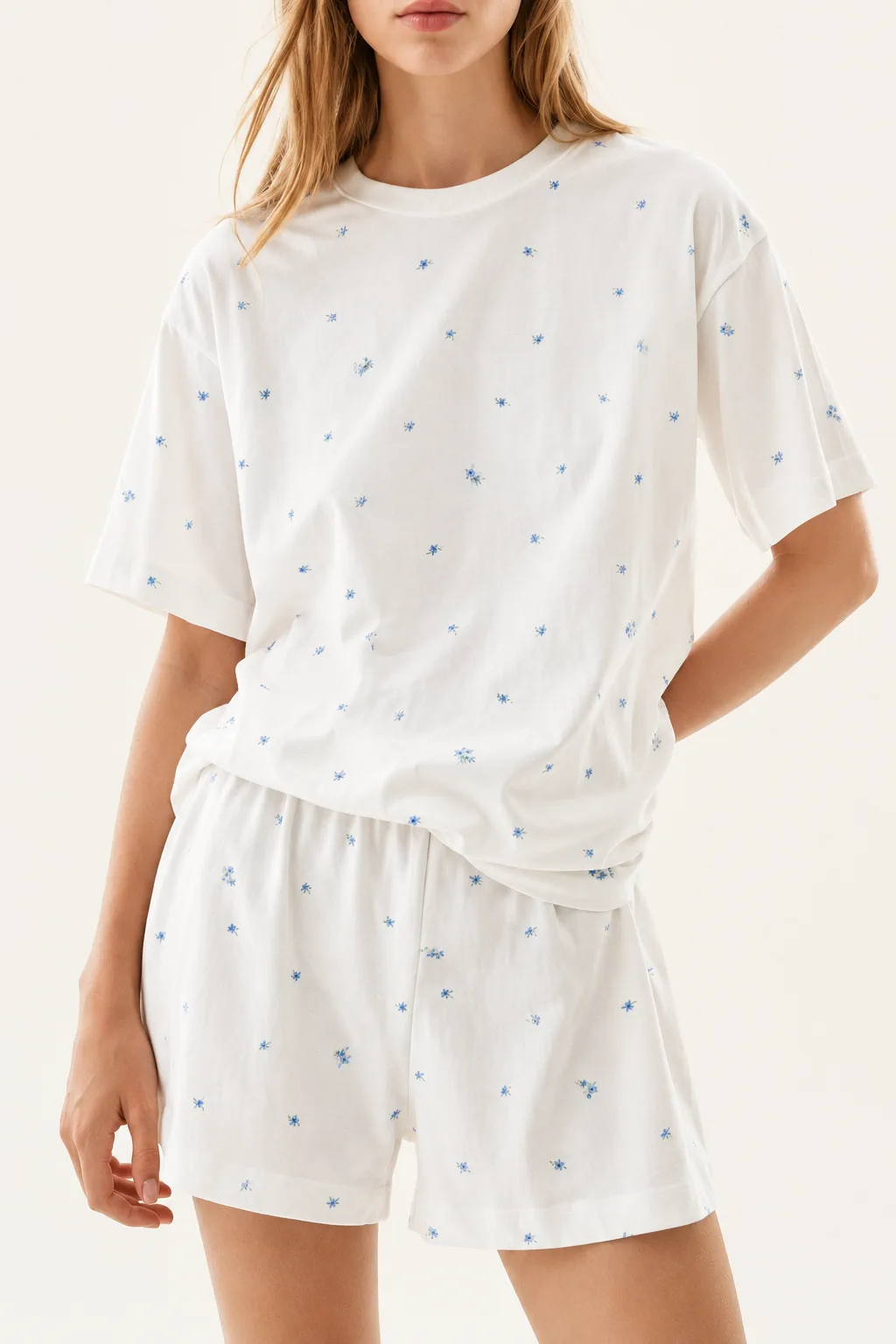White cotton jersey pajama set in a pale print, illustrating why light colorways need finished-sample review
