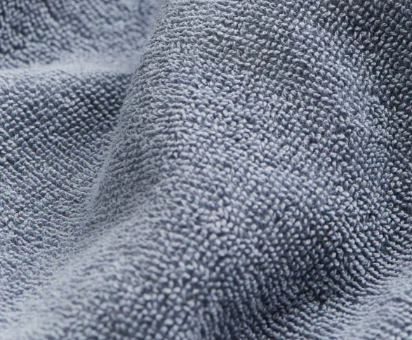 Grey terry loop fabric close-up for bathrobes, spa loungewear and hospitality robe programs