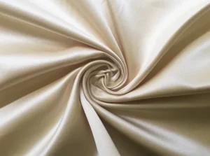 Ivory satin-look smooth woven fabric close-up for premium pajama sets and robes
