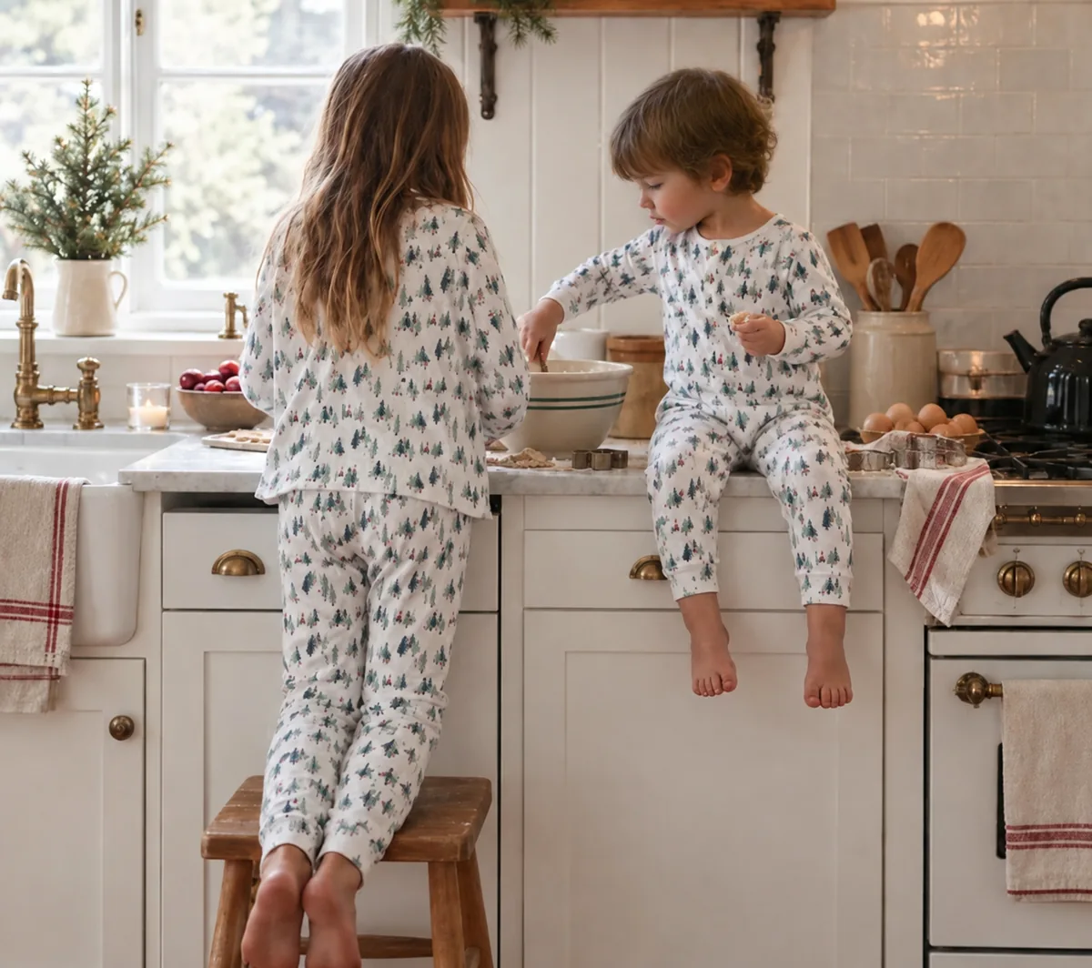 Children in coordinated tree-print pajamas during a family matching sleepwear sample review