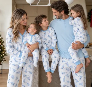 Family in coordinated tree-print pajamas for private-label family matching sleepwear size planning