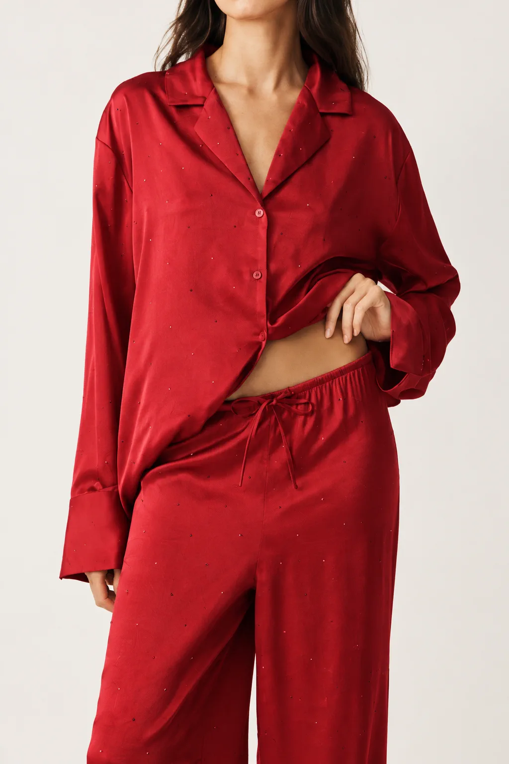 Deep red satin button-front pajama set used to review dark-color shade and garment appearance