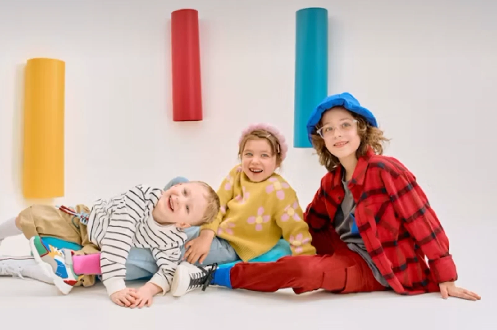 Three children in colorful casualwear for kidswear product development