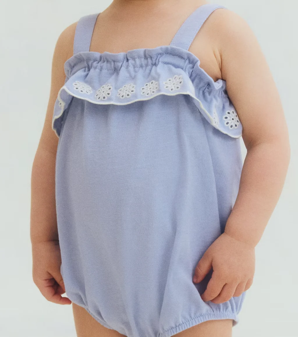 Periwinkle toddler romper sample for reviewing fit, trims and approval changes